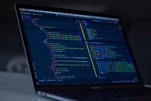 Source code open on a laptop screen